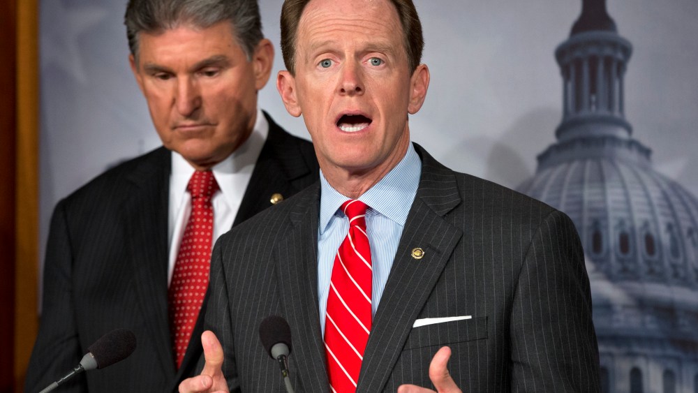 Sen. Joe Manchin, D-W.Va. listens at left, as Sen. Patrick Toomey, R-Pa. announce that they have reached a bipartisan deal on expanding background checks to more gun buyers, Wednesday, April 10, 2013, on Capitol Hill in Washington.  (Photo by J. Scott...