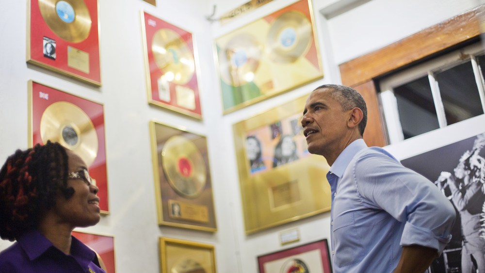 U.S. President Barack Obama, right, visits the Bob Marley Museum with tour guide Natasha Clark, left, April 8, 2015 in Kingston, Jamaica.