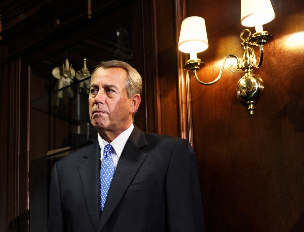 House Speaker John Boehner listens during a news conference at the Republican National Committee offices in Washington, Oct. 23, 2013.