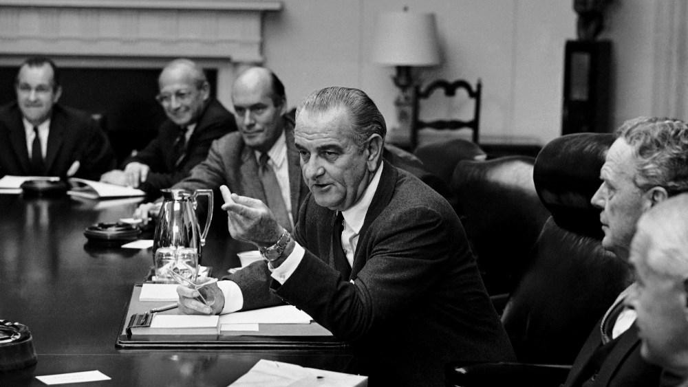 President Lyndon Johnson meets in the White House Cabinet Room with top military and defense advisers on Oct. 31, 1968 in Washington.