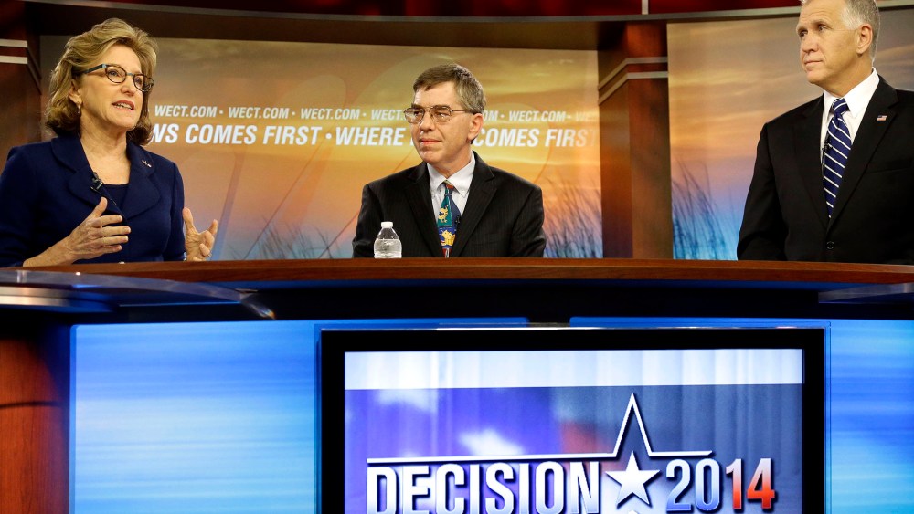 Sen. Kay Hagan, D-N.C., left, speaks as Libertarian Party Senate candidate Sean Haugh, center, and North Carolina Republican Senate candidate Thom Tillis listen during a live televised debate at WECT studios in Wilmington, N.C. on Thursday, Oct. 9, 2014.