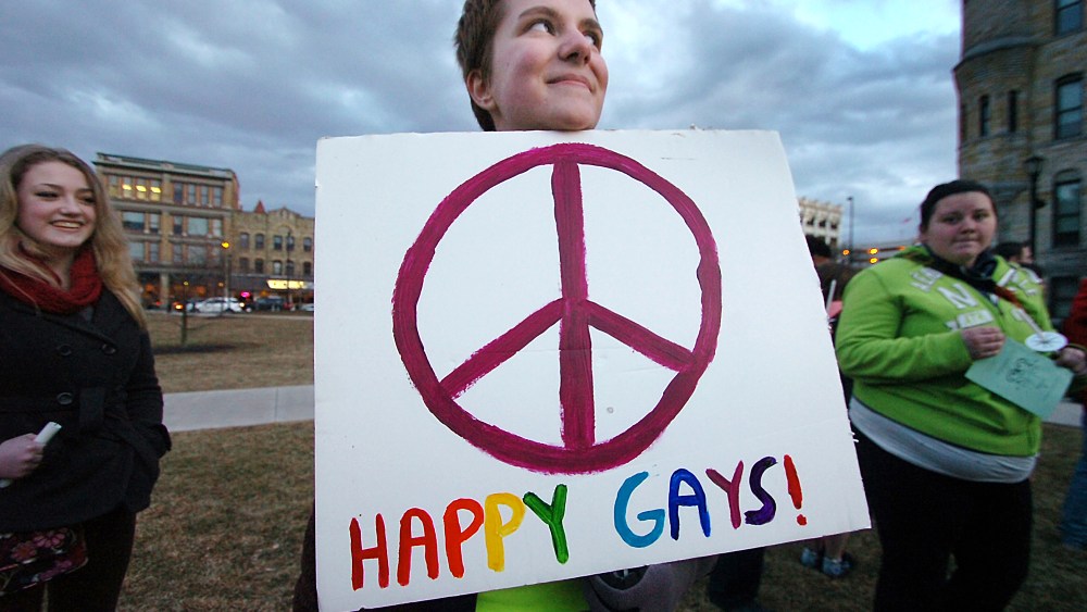Jessica Cerra, 15, of Clarks Summit, Pa. holds her sign during the Scranton Candlelight Vigil for Marriage Equality in advance of the Supreme Court DOMA decision held on Tuesday, March 26, 2013 at the Lackawanna County Courthouse Square in downtown...