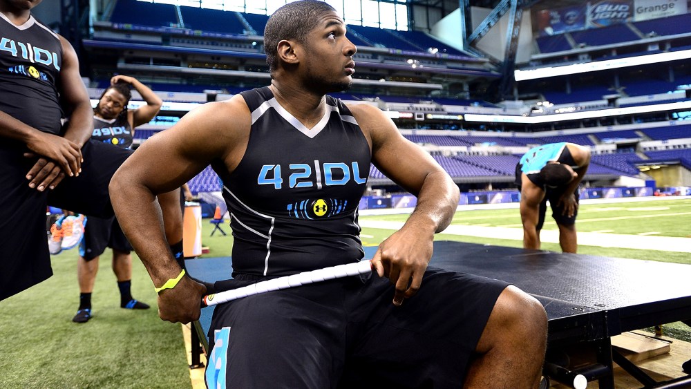 Michael Sam warms up at the 2014 NFL Scouting Combine at Lucas Oil Stadium in Indianapolis, on Feb. 24, 2014.