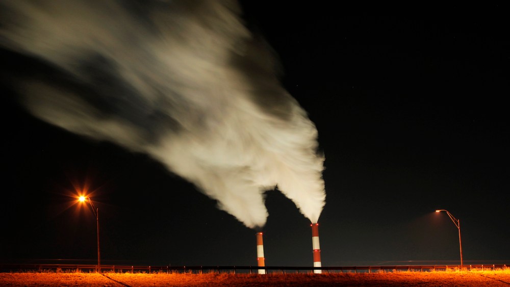 In this Jan. 19, 2012 file photo, smoke rises in this time exposure image from the stacks a coal-fired power plant in La Cygne, Kan. (Photo by Charlie Riedel/AP)