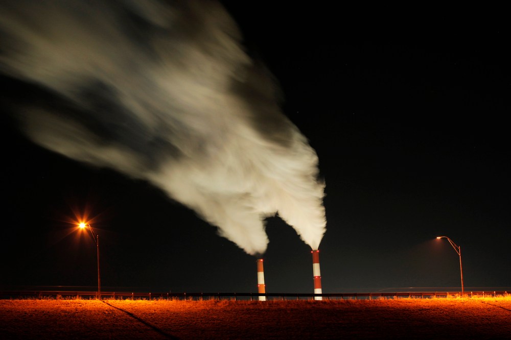In this Jan. 19, 2012 file photo, smoke rises in this time exposure image from the stacks a coal-fired power plant in La Cygne, Kan. (Photo by Charlie Riedel/AP)