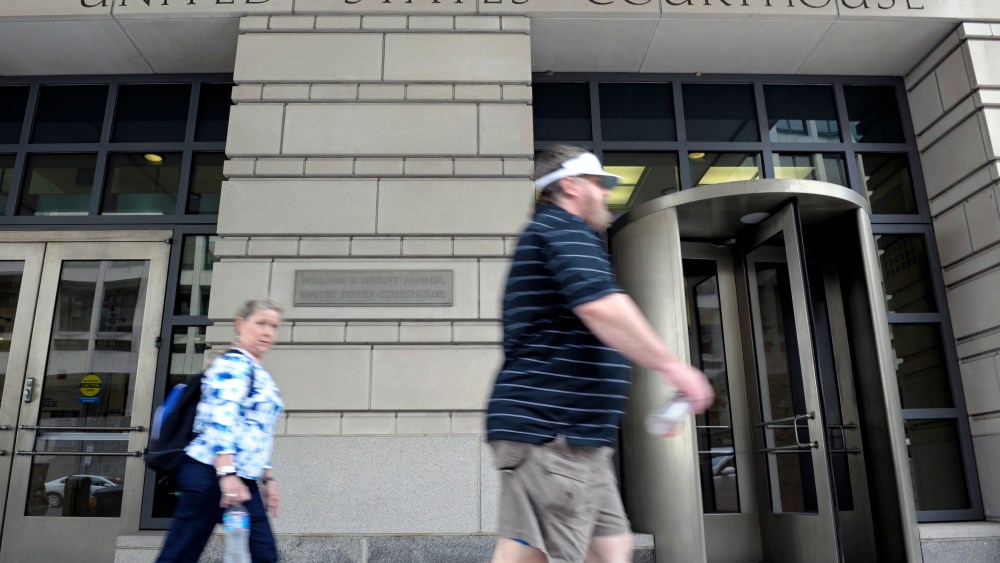 People walk in front of the U.S. Courthouse in Washington, Thursday, June 6, 2013, where the secret Foreign Intelligence Surveillance Court resides. An order was granted by the secret Foreign Intelligence Surveillance Court on April 25, good until July...