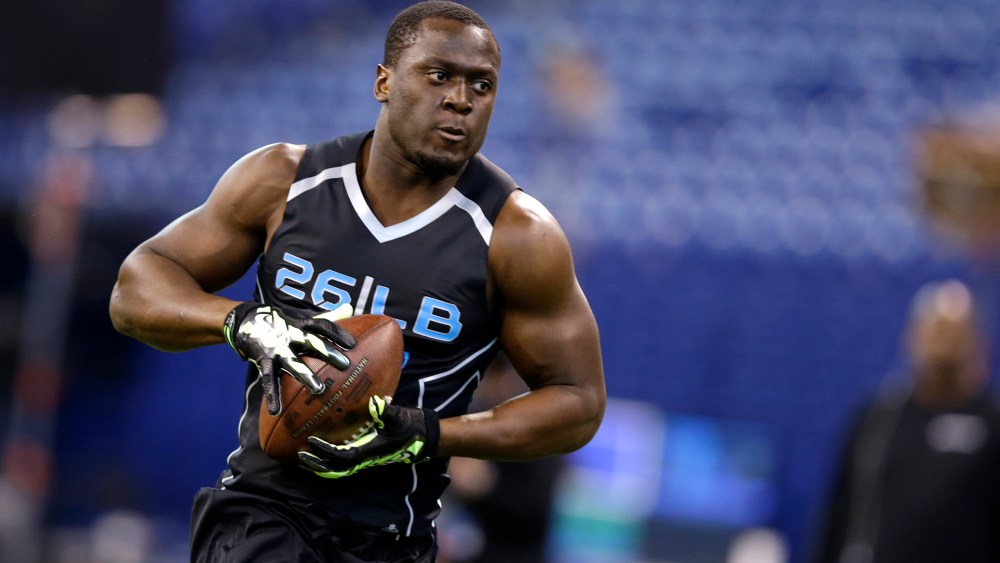Notre Dame linebacker Prince Shembo runs a drill at the NFL football scouting combine in Indianapolis, Feb. 24, 2014. (Photo by Michael Conroy/AP)