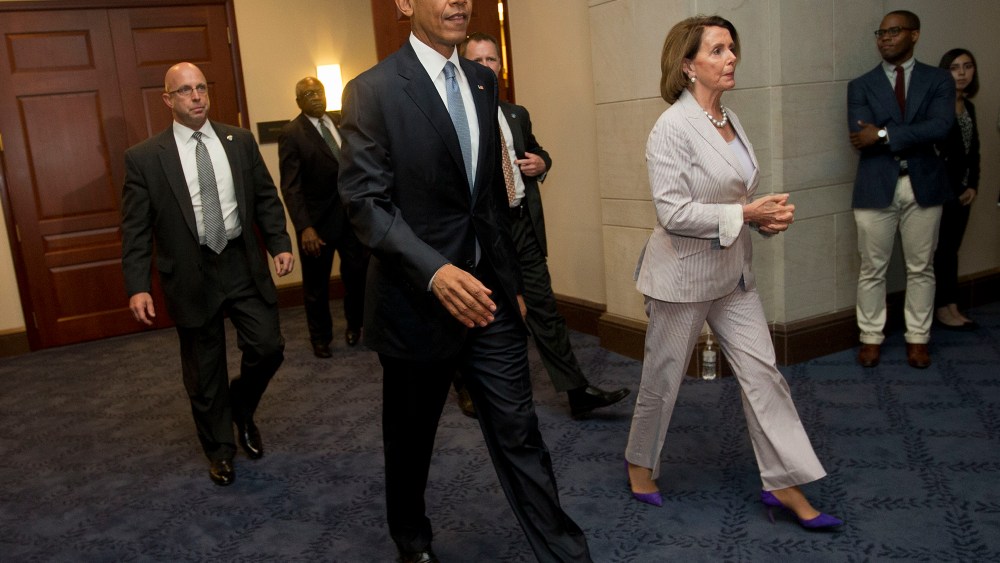 President Barack Obama and House Minority Leader Nancy Pelosi of Calif. leave meeting with House Democrats on Capitol Hill in Washington, June 12, 2015. (Photo by Pablo Martinez Monsivais/AP)
