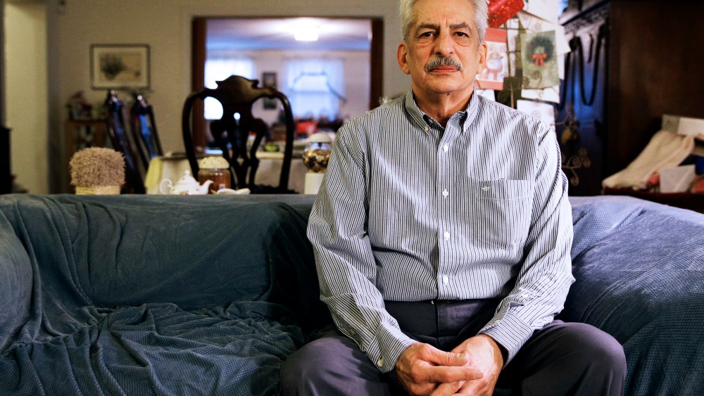Stan Osnowitz, who lost his state unemployment benefits of $430 a week, poses in his living room in Baltimore, Jan. 10, 2014.