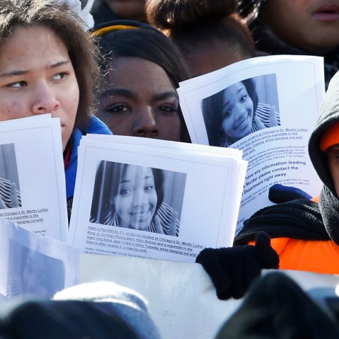 Protesters hold up copied photos of Hadiya Pendleton at the scene where she was killed during an anti-gun violence march and rally Friday, Feb. 1, 2013, in Chicago. The mounting homicide toll in President Barack Obamas hometown is giving ammunition to...