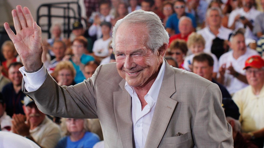 Evangelist Pat Robertson waves at the crowd during a campaign rally for Mitt Romney at the Military Aviation Museum in Virginia Beach, Va., Sept. 8, 2012.