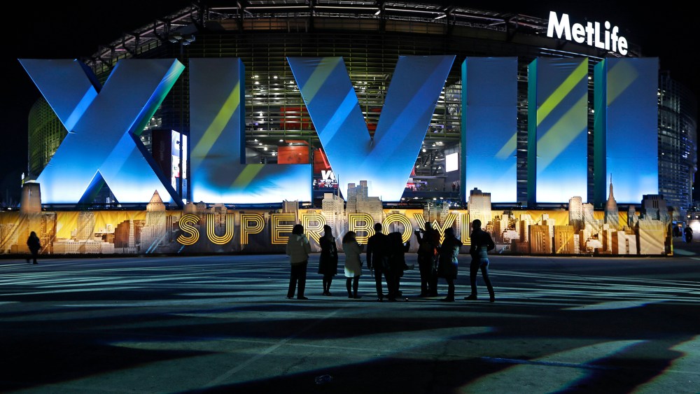 Fans walk near MetLife Stadium before the NFL Super Bowl XLVIII football game between the Seattle Seahawks and the Denver Broncos,Feb. 2, 2014, in East Rutherford, N.J.