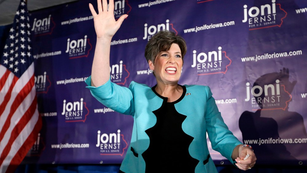 State Sen. Joni Ernst waves to supporters at a primary election night rally, June 3, 2014, in Des Moines, Iowa.