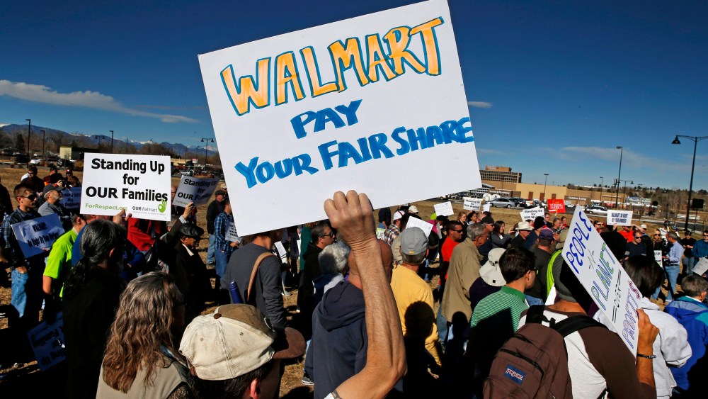 Colorado Walmart employees and supporters join nationwide protests, in front of a Walmart store in Lakewood, Colo. on Nov. 29, 2013.