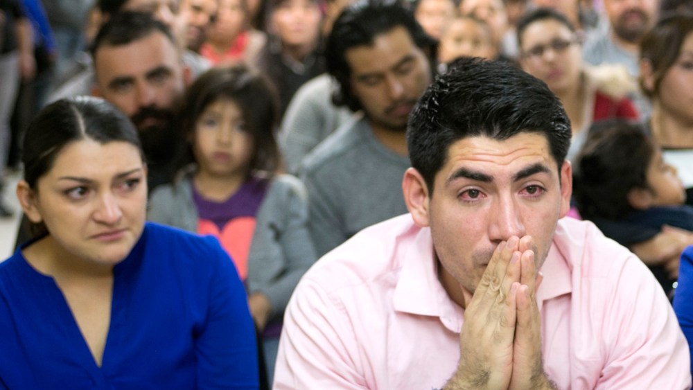 Viridiana Carrizales of San Antonio and Jose Patino, of Phoenix react during a watch party for President Obama's speech on immigration at the Puente offices in Phoenix on Nov. 20, 2014. (Photo: David Wallace/The Republic/AP)