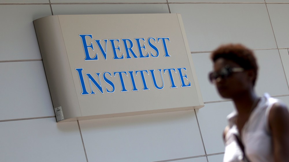 A woman walks past the Everest Institute in Silver Spring, Md. in 2014.