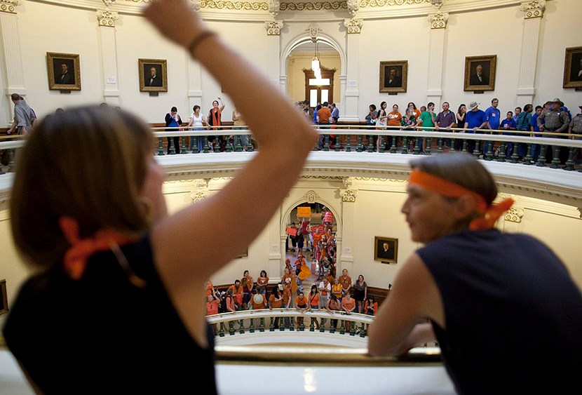 Hallie Boas and Lisa Fithian lead abortion rights chants from the third floor of the Texas Capitol Rotunda in Austin, Texas on Friday, July 12, 2013.  (Photo by Tamir Kalifa/AP)