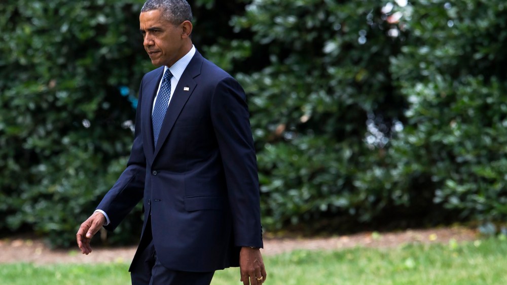 President Barack Obama walks on the South Lawn of the White House in Washington, D.C., June 26, 2014.