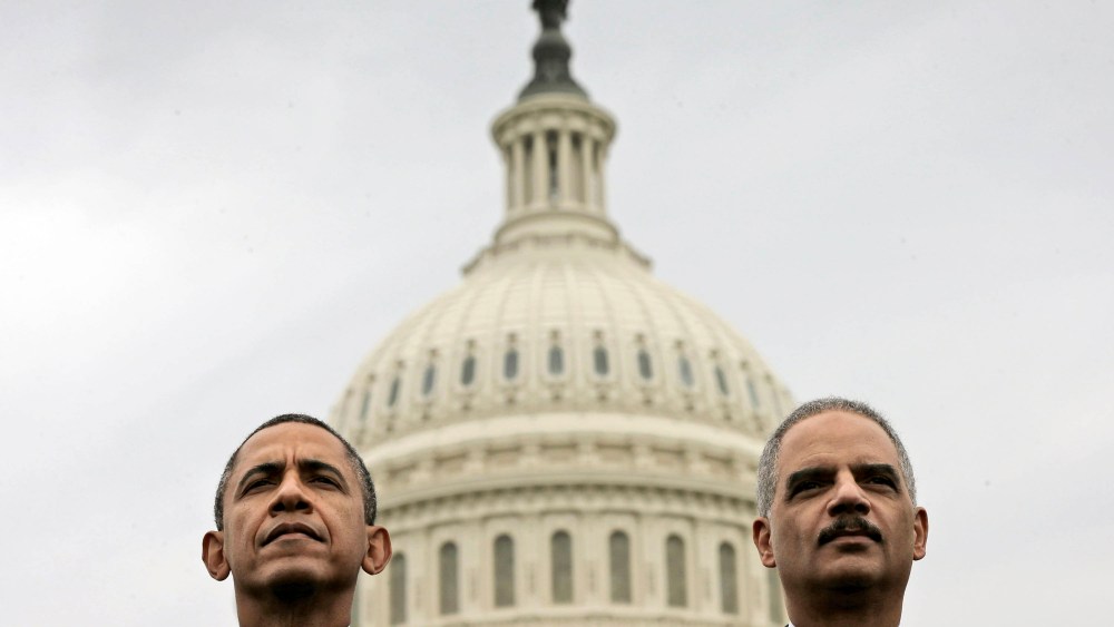 Barack Obama sits with Attorney General Eric Holder during the 32nd annual the National Peace Officers Memorial Service, May 15, 2013, on Capitol Hill in Washington, honoring law enforcement officers who died in the line of duty.