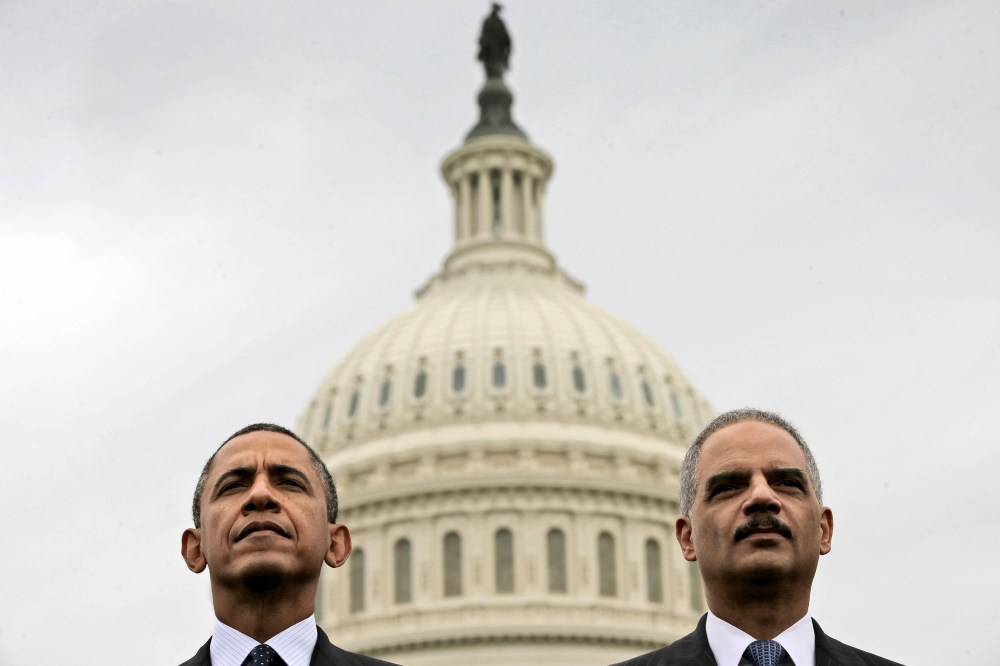 Barack Obama sits with Attorney General Eric Holder during the 32nd annual the National Peace Officers Memorial Service, May 15, 2013, on Capitol Hill in Washington, honoring law enforcement officers who died in the line of duty.