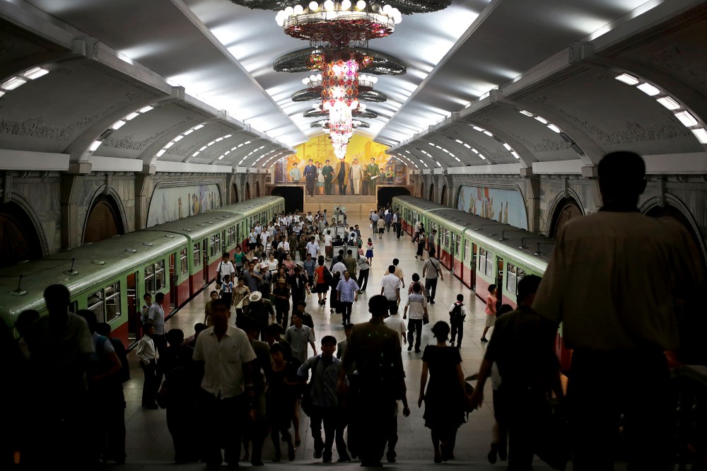 North Koreans make their way to and from a train platform in an underground subway station, Sept. 1, 2014 in Pyongyang, North Korea.