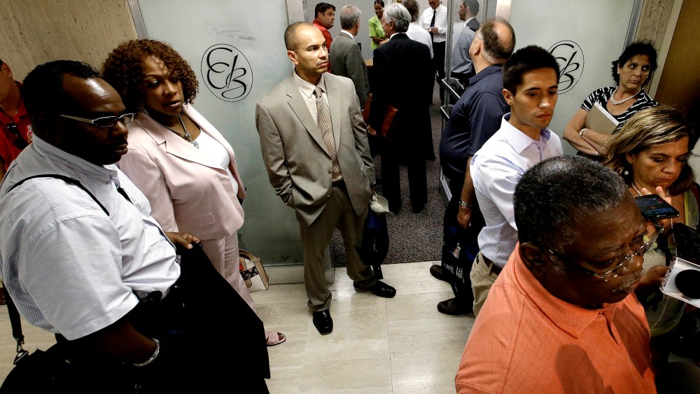Representatives of Detroit's active and retired public workers wait for a meeting to start in Detroit, on July 10, 2013.