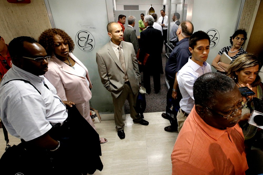 Representatives of Detroit's active and retired public workers wait for a meeting to start in Detroit, on July 10, 2013.