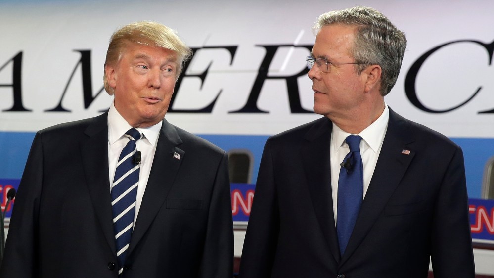 Republican presidential candidates Donald Trump and former Florida Gov. Jeb Bush talk together before the start of the CNN Republican presidential debate, Sep. 16, 2015, in Simi Valley, Calif. (Photo by Chris Carlson/AP)