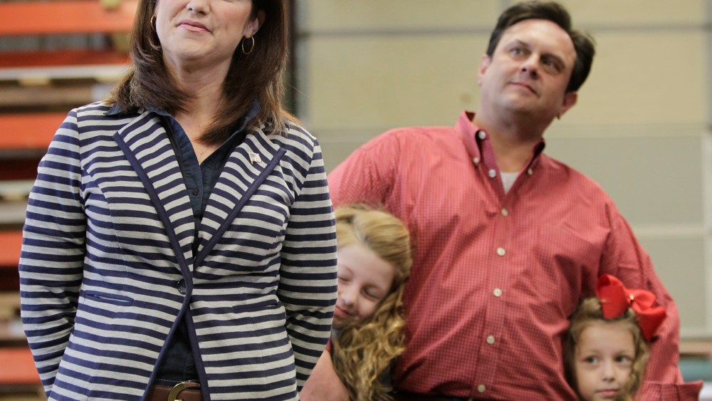 Wisconsin Lt. Gov. Rebecca Kleefisch and her family wait for their introduction at a campaign rally for Kleefisch and Gov. Scott Walker in Dane, Wis., April 15, 2014.