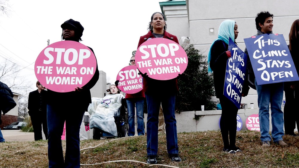 Abortion rights supporters stand outside the Jackson Women's Health Organization Inc., in Jackson, Miss., on Jan. 22, 2013.