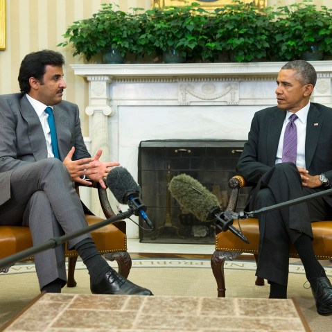 President Barack Obama meets with the Emir of Qatar Sheikh Tamim bin Hamad al Thani, on Feb. 24, 2015, in the Oval Office of the White House in Washington. (Photo by Evan Vucci/AP)