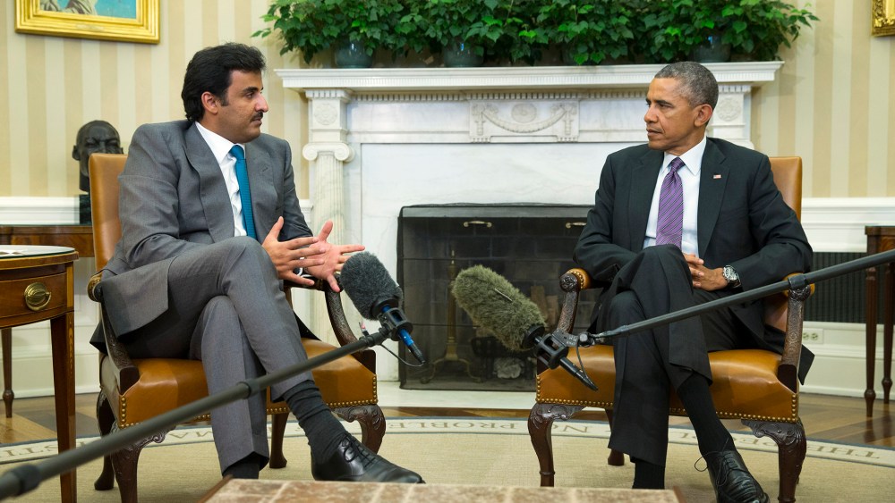 President Barack Obama meets with the Emir of Qatar Sheikh Tamim bin Hamad al Thani, on Feb. 24, 2015, in the Oval Office of the White House in Washington. (Photo by Evan Vucci/AP)