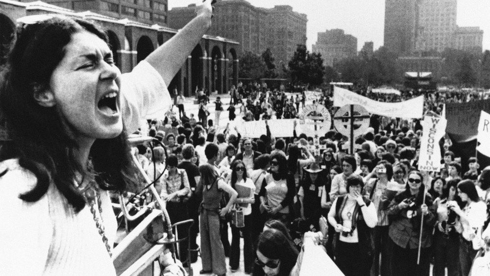 Karen DeCrow, president of the National Organization for Women, shouts to a crowd during a NOW parade held in Philadelphia, Oct. 25, 1975.