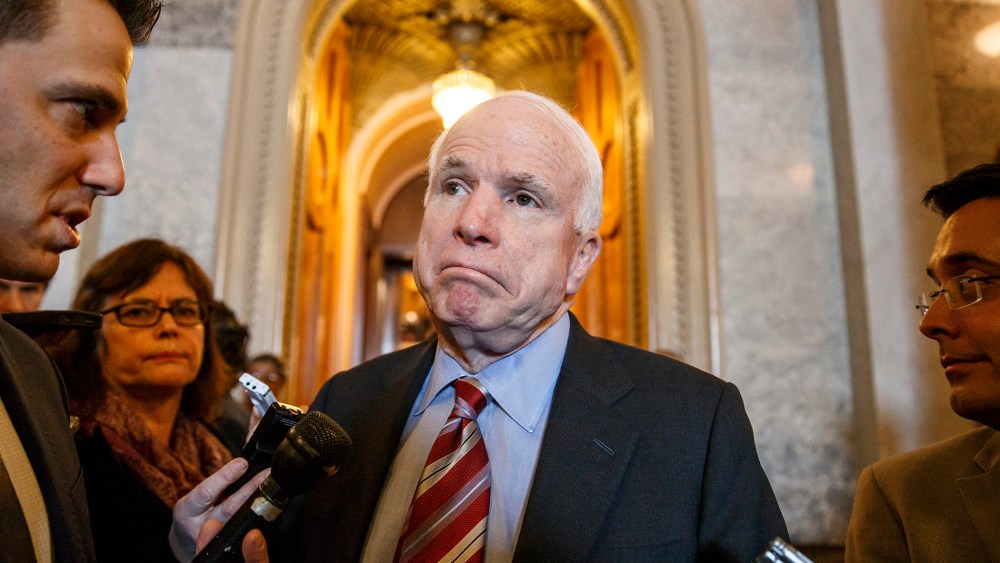Sen. John McCain leaves the Senate chamber, March 5, 2014.