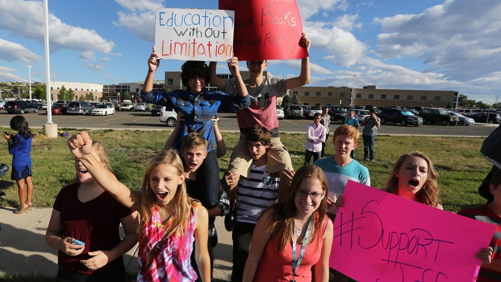 Students protest outside of Ralston Valley High School, Sept. 23, 2014, in Arvada, Colo. (Photo by Brennan Linsley/AP)