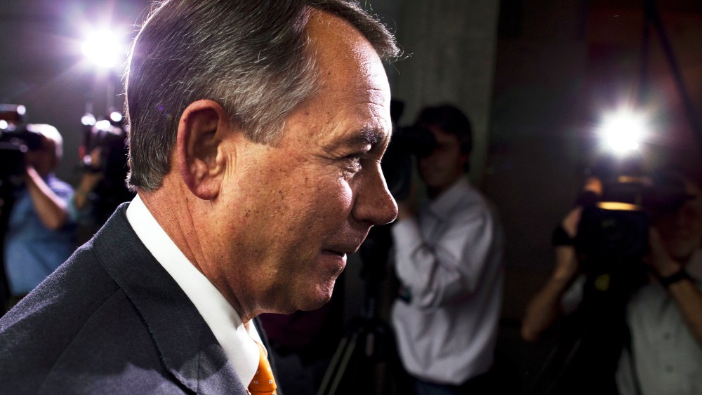 Speaker of the House John Boehner walks past reporters after a meeting with House Republicans on Capitol Hill on Wednesday, Oct. 16, 2013 in Washington.