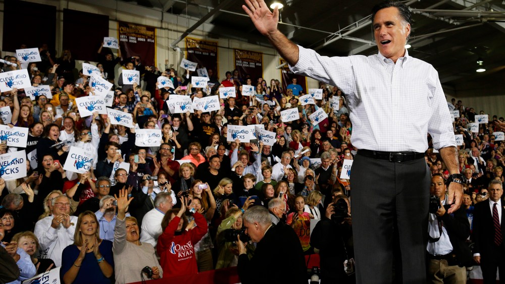 Republican presidential candidate, former Massachusetts Gov. Mitt Romney waves to supporters as he takes the stage at a campaign stop at Avon Lake High School in Avon Lake, Ohio, Oct. 29, 2012.