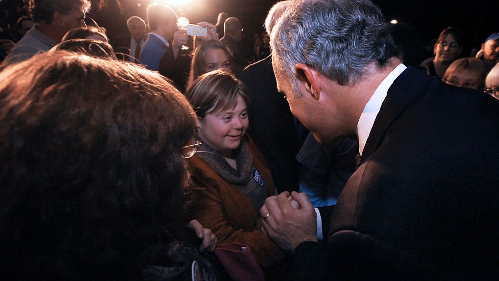 U.S. Sen. Bob Casey, right, greets Sara Wolff in downtown Scranton, Pa.