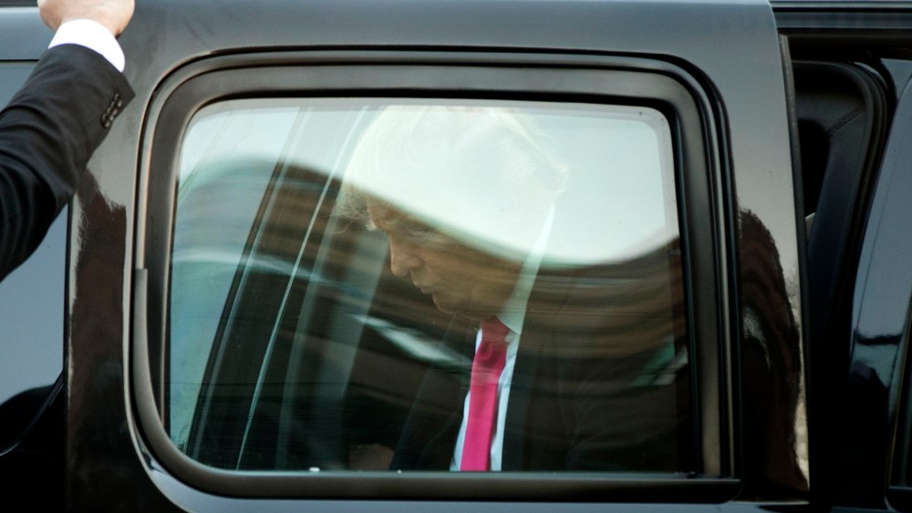 Republican presidential candidate Donald Trump arrives at a hotel for interviews, Feb. 7, 2016, in Manchester, N.H. (Photo by Matt Rourke/AP)
