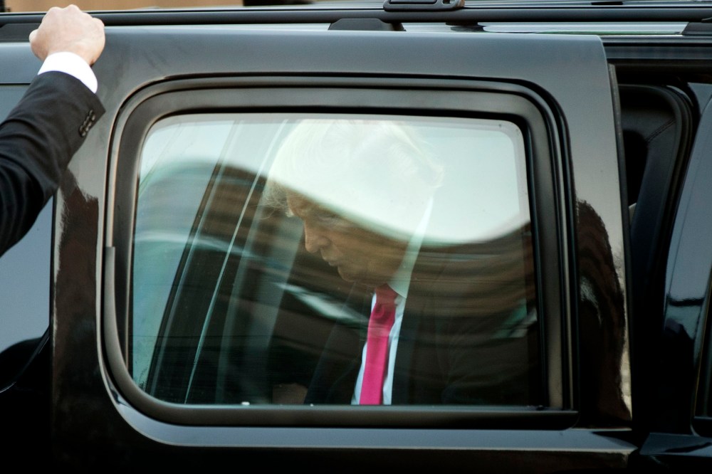 Republican presidential candidate Donald Trump arrives at a hotel for interviews, Feb. 7, 2016, in Manchester, N.H. (Photo by Matt Rourke/AP)