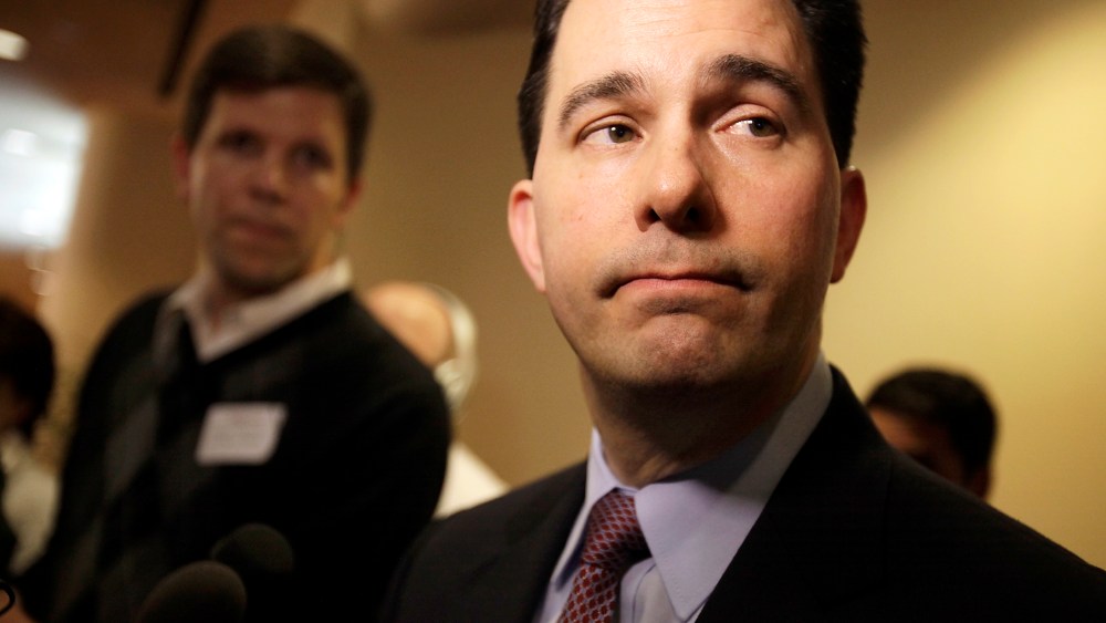 Wisconsin Gov. Scott Walker listens to a question while speaking with media about his proposed reforms to Medicaid, unemployment compensation, and food stamps, at Business Day in Madison, Wis. on Feb. 13, 2013.
