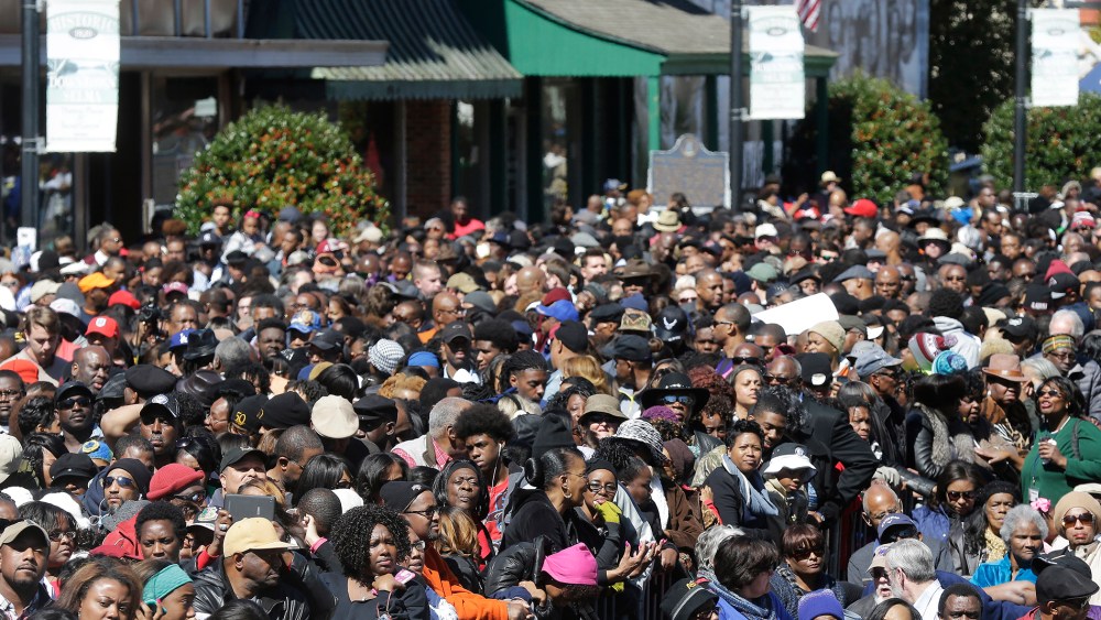 A large crowd forms near a stage where President Barack Obama will speak and then take a symbolic walk across the Edmund Pettus Bridge on March 7, 2015, in Selma, Ala. (Photo by Gerald Herbert/AP)