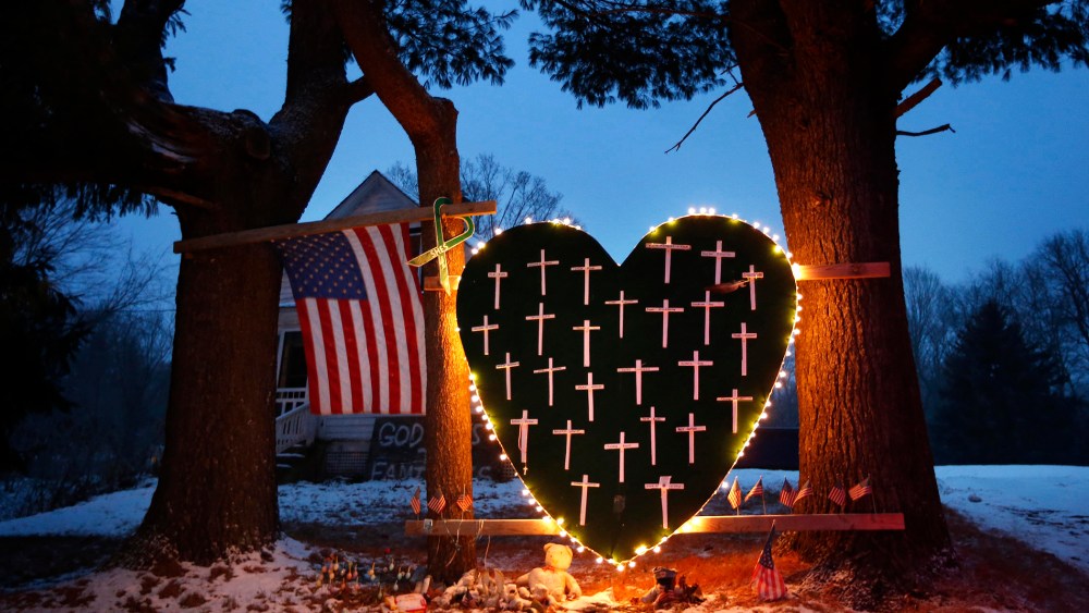 A makeshift memorial with crosses for the victims of the Sandy Hook Elementary School shooting massacre stands outside a home in Newtown, Conn. on Dec. 14, 2013. (Robert F. Bukaty/AP)