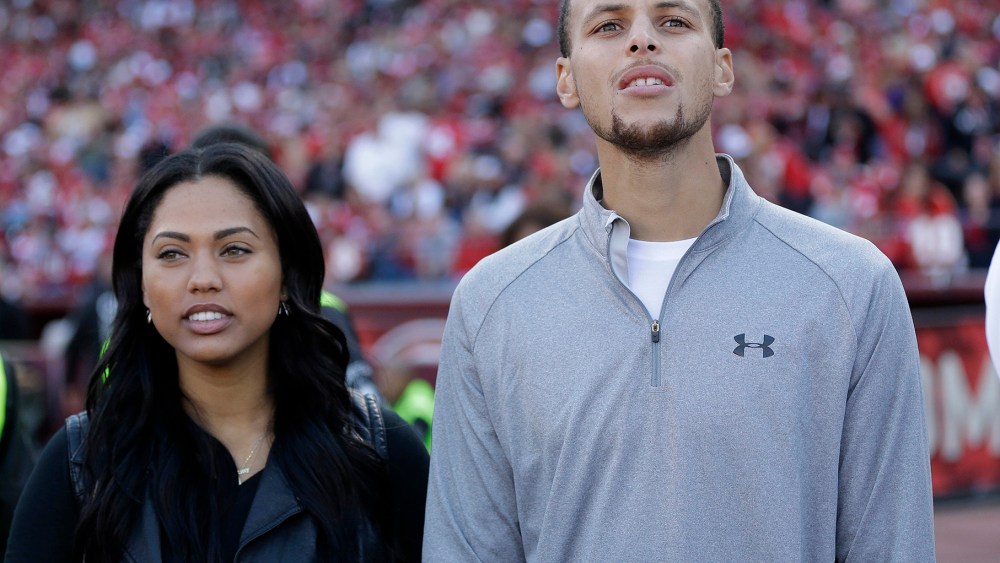Golden State Warriors player Stephen Curry and his wife Ayesha Curry watch as the San Francisco 49ers play the Carolina Panthers during the third quarter of an NFL football game in San Francisco, Nov. 10, 2013. (Photo by Marcio Jose Sanchez/AP)