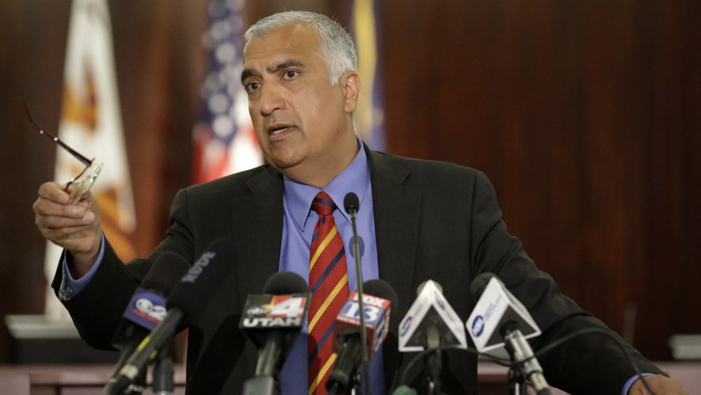 In this June 19, 2014, file photo, District Attorney Sim Gill speaks during a new conference, in Salt Lake City. (Photo by Rick Bowmer/AP)
