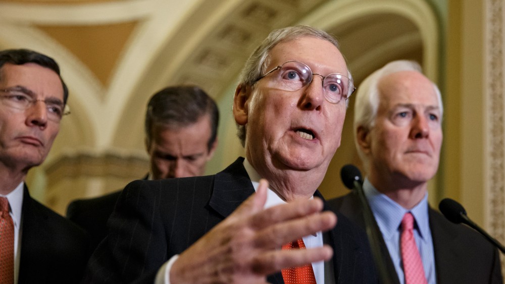 Senate Minority Leader Mitch McConnell speaks with reporters following a closed-door policy meeting at the Capitol in Washington on Dec. 2, 2014. (J. Scott Applewhite/AP)