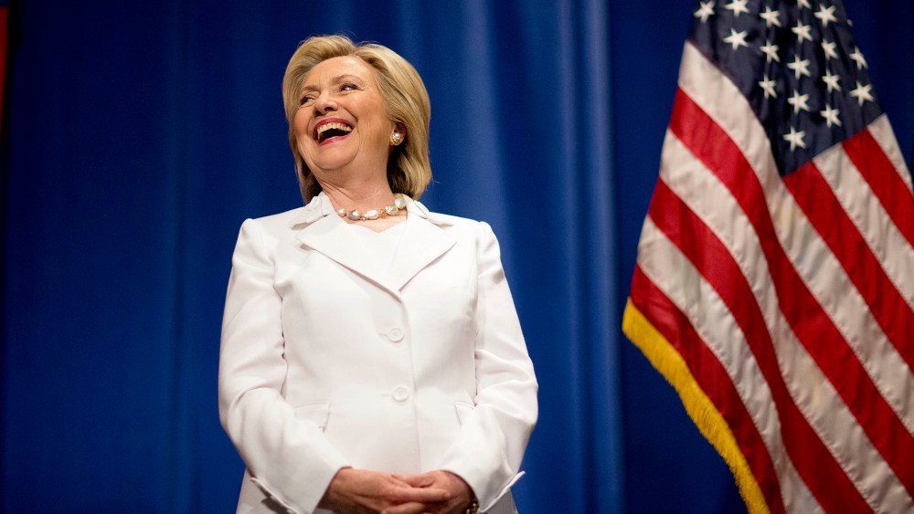 Democratic presidential candidate Hillary Rodham Clinton steps onstage to address an audience at Trident Technical College during a campaign stop, June 17, 2015, in North Charleston, S.C. (Photo by David Goldman/AP)