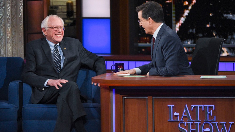 This image released by CBS shows Democratic presidential candidate Sen. Bernie Sanders, of Vermont, with host Stephen Colbert during a taping of "The Late Show with Stephen Colbert," Feb. 10, 2016, in New York. (Photo by Jeffrey R. Staab/CBS/AP)