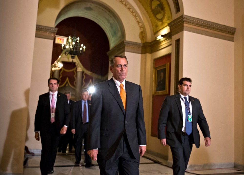 Speaker of the House John Boehner walks to the chamber for the vote on a Senate-passed bill that would avert a threatened Treasury default and reopen the government in Washington, Wednesday, Oct. 16, 2013.