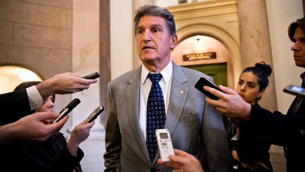 Sen. Joe Manchin, D-W.Va., is questioned for updates by reporters at the Capitol in Washington, Monday, Oct. 14, 2013, as a partial government shutdown enters its third week.